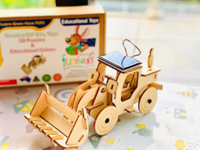 V277-MBTT-190267-00 Model Bulldozer Tipper truck: Solar or battery powered plywood model-includes Motor or Solar powered options plus paint brush set - Image 1