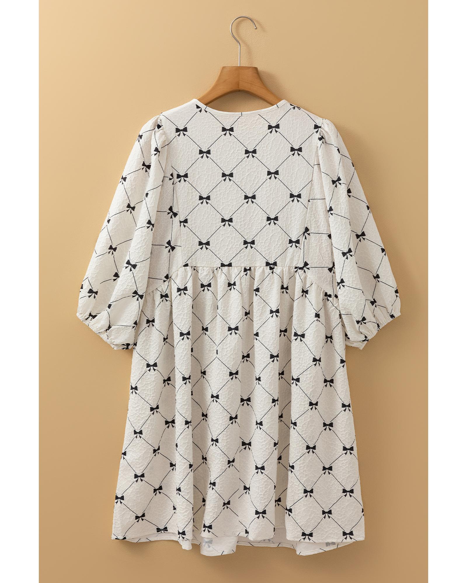 V539-AZEXDC6122762-P120-M-202508311405-00 White Bowtie Pattern Textured Puff Half Sleeve Loose Mini Dress - M - Image 1