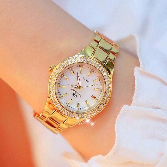 V562-B106874270DBT-202508281232-00 Women Round Diamond Watch with Alloy Strap - Gold - Image 1